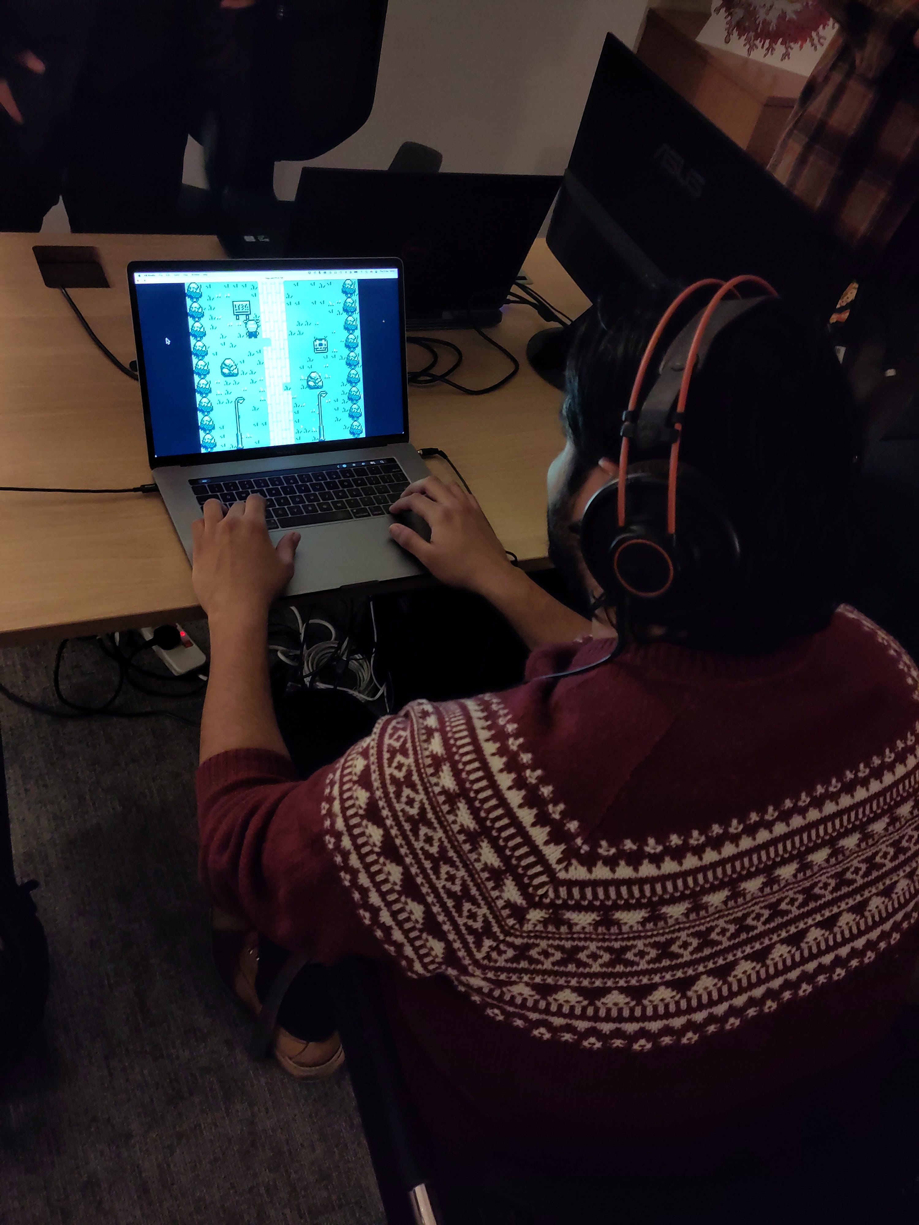 A photo of someone playing the game on a laptop.