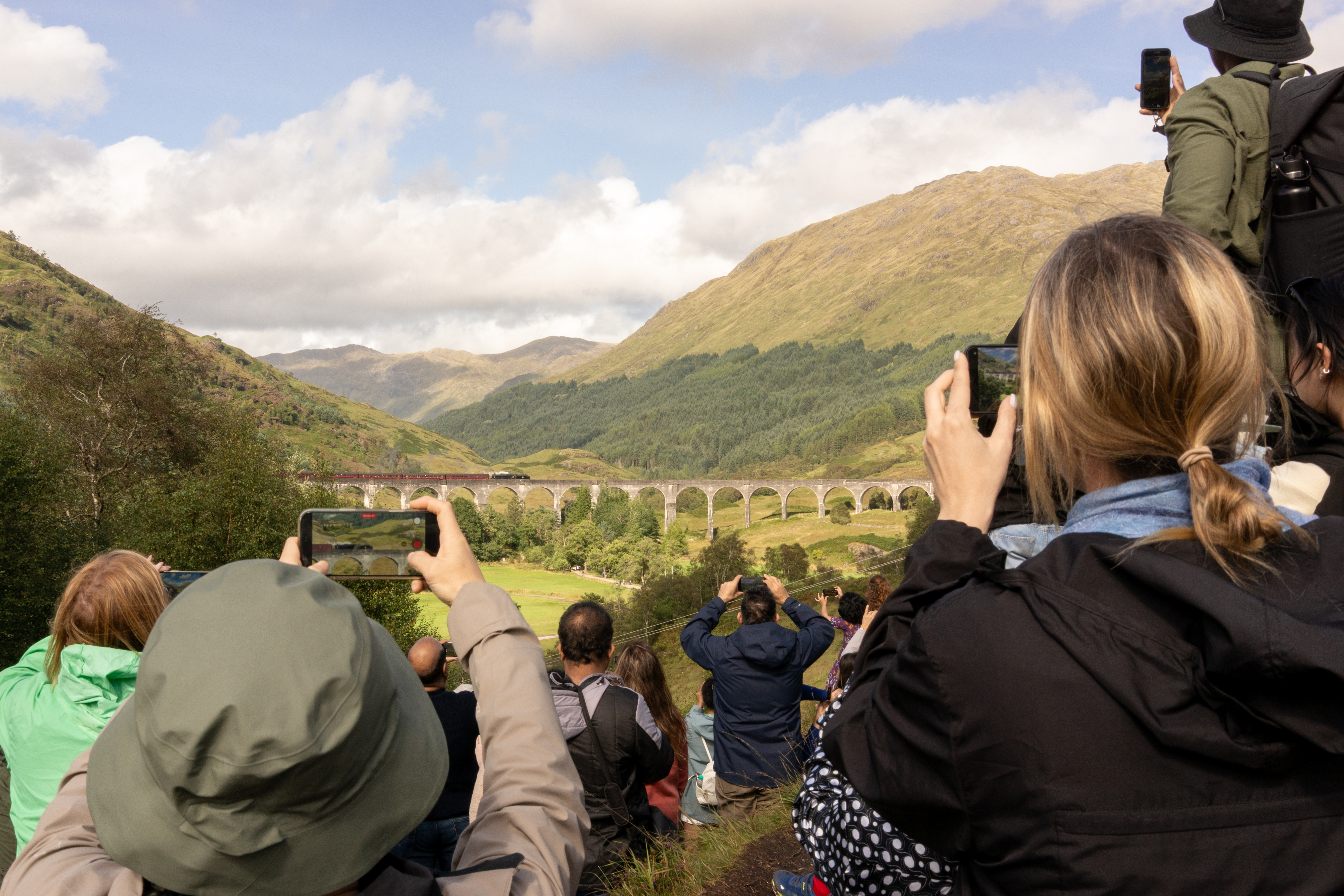 People crowded around to see the Gelnfinnan Viaduct train